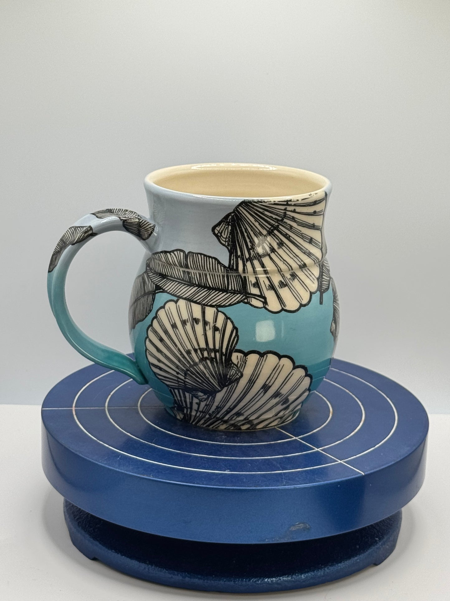 Shells and Banana Leaves in Blue Ombré Stoneware Coffee and Tea Mug