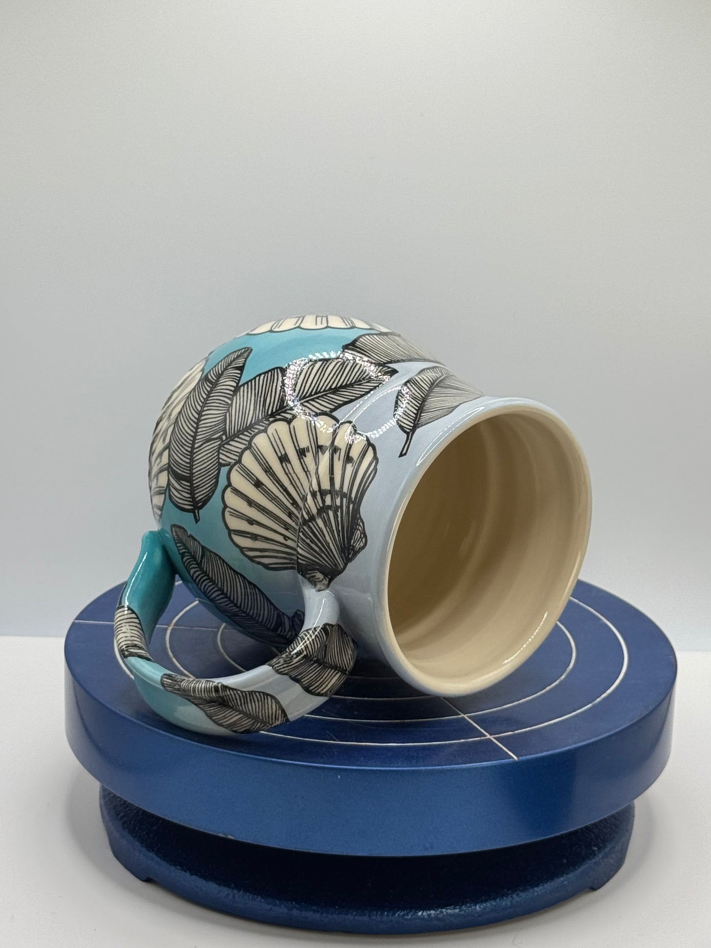 Shells and Banana Leaves in Blue Ombré Stoneware Coffee and Tea Mug